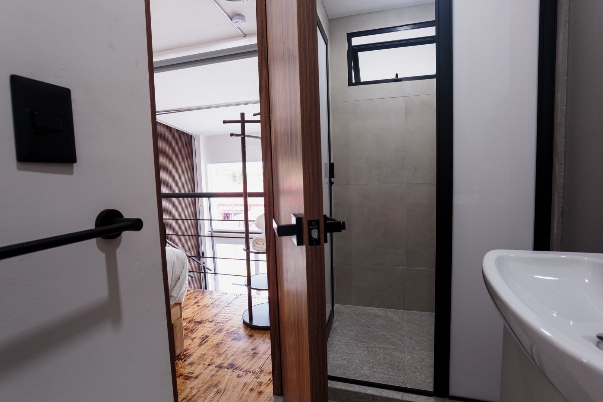 Sol bathroom opening onto the mezzanine bedroom.